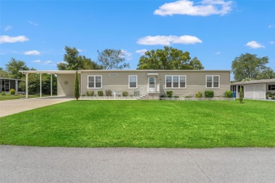 This beautifully maintained 3-bedroom, 2-bath home sits on a on Brookridge Country Club in Florida - for sale on GolfHomes.com, golf home, golf lot