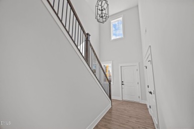 Welcome home to this spacious 4-bedroom, 2.5-bath residence on Olde Liberty Golf and Country Club in North Carolina - for sale on GolfHomes.com, golf home, golf lot