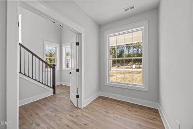 Welcome home to this spacious 4-bedroom, 2.5-bath residence on Olde Liberty Golf and Country Club in North Carolina - for sale on GolfHomes.com, golf home, golf lot