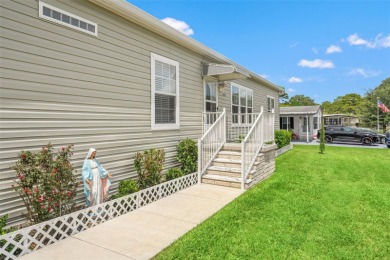 This beautifully maintained 3-bedroom, 2-bath home sits on a on Brookridge Country Club in Florida - for sale on GolfHomes.com, golf home, golf lot