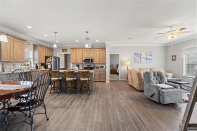 This beautifully maintained 3-bedroom, 2-bath home sits on a on Brookridge Country Club in Florida - for sale on GolfHomes.com, golf home, golf lot