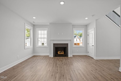 Welcome home to this spacious 4-bedroom, 2.5-bath residence on Olde Liberty Golf and Country Club in North Carolina - for sale on GolfHomes.com, golf home, golf lot