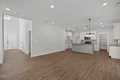 Welcome home to this spacious 4-bedroom, 2.5-bath residence on Olde Liberty Golf and Country Club in North Carolina - for sale on GolfHomes.com, golf home, golf lot