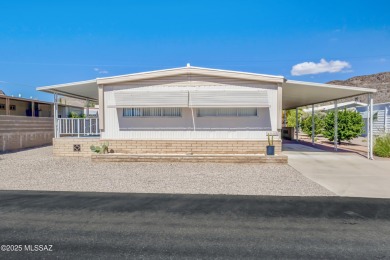 Welcome home to this charming home surrounded by majestic on Tucson Estates Golf Course in Arizona - for sale on GolfHomes.com, golf home, golf lot