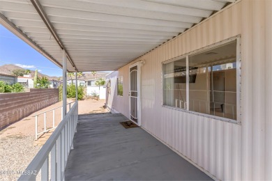Welcome home to this charming home surrounded by majestic on Tucson Estates Golf Course in Arizona - for sale on GolfHomes.com, golf home, golf lot