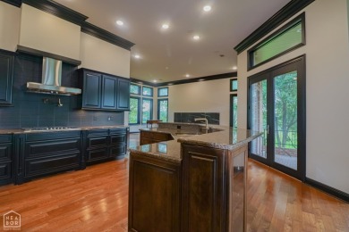 This stunning all-brick home, has been completely remodeled to on RidgePointe Country Club in Arkansas - for sale on GolfHomes.com, golf home, golf lot