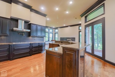This stunning all-brick home, has been completely remodeled to on RidgePointe Country Club in Arkansas - for sale on GolfHomes.com, golf home, golf lot
