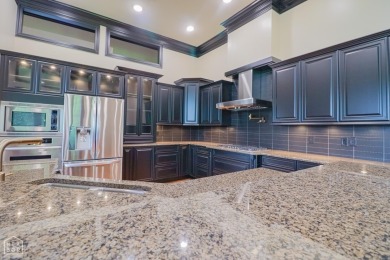 This stunning all-brick home, has been completely remodeled to on RidgePointe Country Club in Arkansas - for sale on GolfHomes.com, golf home, golf lot