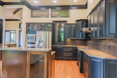 This stunning all-brick home, has been completely remodeled to on RidgePointe Country Club in Arkansas - for sale on GolfHomes.com, golf home, golf lot