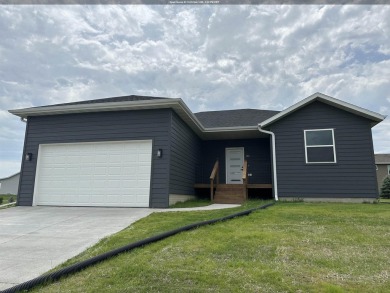 Let's take a look at this new build in Akron, Iowa. This on Akron Golf Course in Iowa - for sale on GolfHomes.com, golf home, golf lot