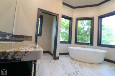 This stunning all-brick home, has been completely remodeled to on RidgePointe Country Club in Arkansas - for sale on GolfHomes.com, golf home, golf lot