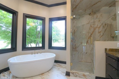 This stunning all-brick home, has been completely remodeled to on RidgePointe Country Club in Arkansas - for sale on GolfHomes.com, golf home, golf lot