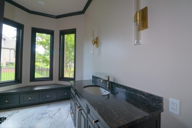 This stunning all-brick home, has been completely remodeled to on RidgePointe Country Club in Arkansas - for sale on GolfHomes.com, golf home, golf lot