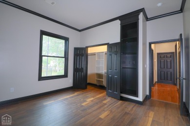 This stunning all-brick home, has been completely remodeled to on RidgePointe Country Club in Arkansas - for sale on GolfHomes.com, golf home, golf lot