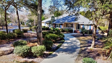 This impressive custom built home sits on a corner lot and on Oyster Bay Golf Links in North Carolina - for sale on GolfHomes.com, golf home, golf lot