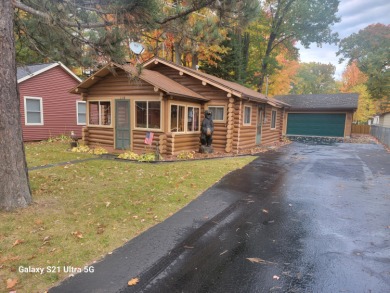 Charming updated and well kept log cabin just 3 homes from the on Pine View Highlands Golf Course in Michigan - for sale on GolfHomes.com, golf home, golf lot