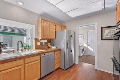 Experience Liberty Lake Golf Course Living at its finest in the on Meadow Wood Golf Course in Washington - for sale on GolfHomes.com, golf home, golf lot