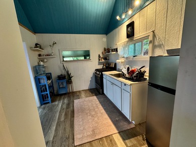 This well-built and thoughtfully designed 476 sq ft studio on Volcano Golf and Country Club in Hawaii - for sale on GolfHomes.com, golf home, golf lot