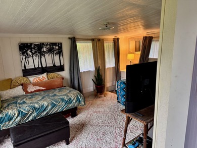 This well-built and thoughtfully designed 476 sq ft studio on Volcano Golf and Country Club in Hawaii - for sale on GolfHomes.com, golf home, golf lot