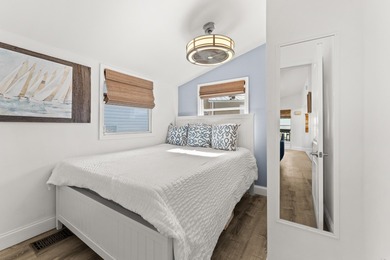 Charming and renovated, this 2-bedroom, 1-bath retreat is on Island Dunes Country Club in Florida - for sale on GolfHomes.com, golf home, golf lot