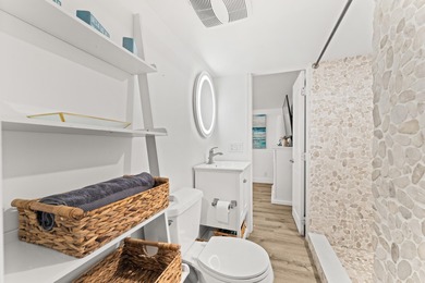 Charming and renovated, this 2-bedroom, 1-bath retreat is on Island Dunes Country Club in Florida - for sale on GolfHomes.com, golf home, golf lot