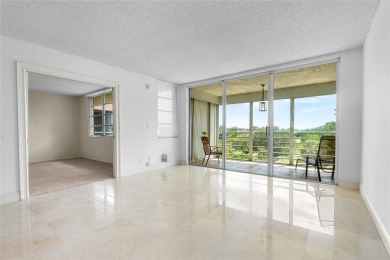 Move-in ready condo in the heart of Palm Aire featuring two en on Palm-Aire Country Club and Resort - The Oaks in Florida - for sale on GolfHomes.com, golf home, golf lot