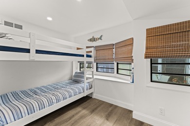 Charming and renovated, this 2-bedroom, 1-bath retreat is on Island Dunes Country Club in Florida - for sale on GolfHomes.com, golf home, golf lot