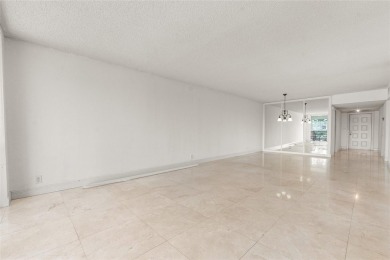 Move-in ready condo in the heart of Palm Aire featuring two en on Palm-Aire Country Club and Resort - The Oaks in Florida - for sale on GolfHomes.com, golf home, golf lot