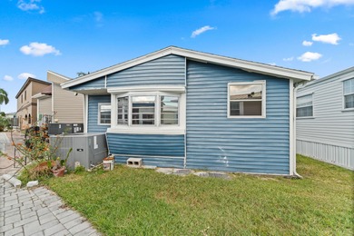 Charming and renovated, this 2-bedroom, 1-bath retreat is on Island Dunes Country Club in Florida - for sale on GolfHomes.com, golf home, golf lot