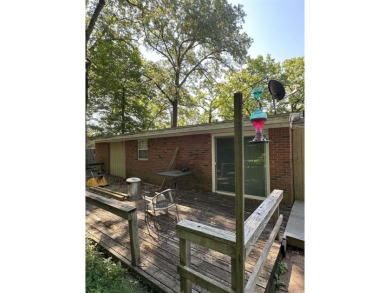 If you are looking for a smaller house with a big big yard on a on Cherokee Village North Course in Arkansas - for sale on GolfHomes.com, golf home, golf lot