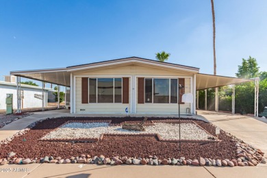Don't miss this adorable 2-bedroom mobile home in Apache Wells! on Apache Wells Country Club in Arizona - for sale on GolfHomes.com, golf home, golf lot
