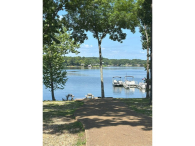 If you are looking for a smaller house with a big big yard on a on Cherokee Village North Course in Arkansas - for sale on GolfHomes.com, golf home, golf lot