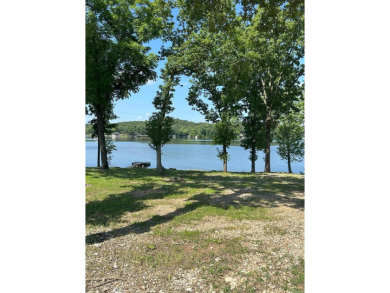 If you are looking for a smaller house with a big big yard on a on Cherokee Village North Course in Arkansas - for sale on GolfHomes.com, golf home, golf lot