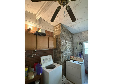 If you are looking for a smaller house with a big big yard on a on Cherokee Village North Course in Arkansas - for sale on GolfHomes.com, golf home, golf lot