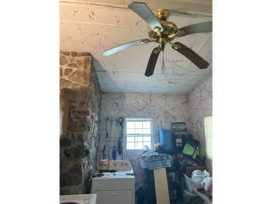 If you are looking for a smaller house with a big big yard on a on Cherokee Village North Course in Arkansas - for sale on GolfHomes.com, golf home, golf lot