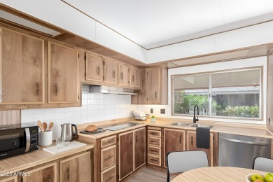 Don't miss this adorable 2-bedroom mobile home in Apache Wells! on Apache Wells Country Club in Arizona - for sale on GolfHomes.com, golf home, golf lot