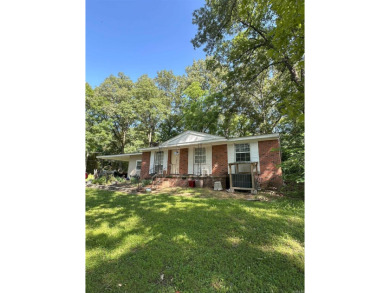 If you are looking for a smaller house with a big big yard on a on Cherokee Village North Course in Arkansas - for sale on GolfHomes.com, golf home, golf lot