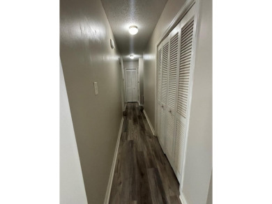 This 3 bedroom home is located in Diamondhead. Wood burning on Diamondhead Country Club in Mississippi - for sale on GolfHomes.com, golf home, golf lot