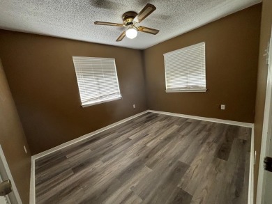 This 3 bedroom home is located in Diamondhead. Wood burning on Diamondhead Country Club in Mississippi - for sale on GolfHomes.com, golf home, golf lot