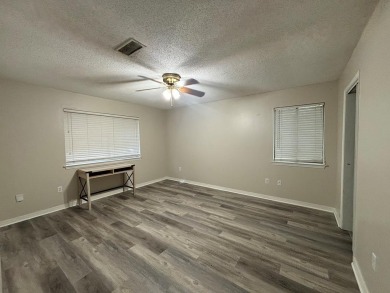 This 3 bedroom home is located in Diamondhead. Wood burning on Diamondhead Country Club in Mississippi - for sale on GolfHomes.com, golf home, golf lot