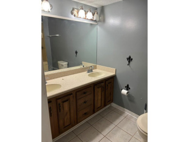 This 3 bedroom home is located in Diamondhead. Wood burning on Diamondhead Country Club in Mississippi - for sale on GolfHomes.com, golf home, golf lot