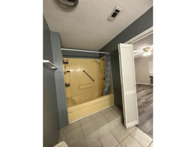 This 3 bedroom home is located in Diamondhead. Wood burning on Diamondhead Country Club in Mississippi - for sale on GolfHomes.com, golf home, golf lot