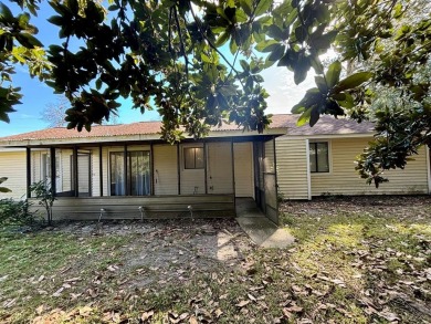 This 3 bedroom home is located in Diamondhead. Wood burning on Diamondhead Country Club in Mississippi - for sale on GolfHomes.com, golf home, golf lot