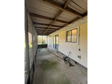 This 3 bedroom home is located in Diamondhead. Wood burning on Diamondhead Country Club in Mississippi - for sale on GolfHomes.com, golf home, golf lot