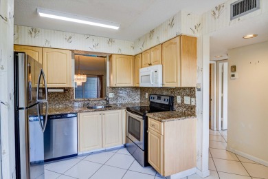 Located in the gated community of Huntington Lakes in Delray on Marina Lakes Golf Course in Florida - for sale on GolfHomes.com, golf home, golf lot