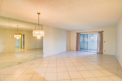 Located in the gated community of Huntington Lakes in Delray on Marina Lakes Golf Course in Florida - for sale on GolfHomes.com, golf home, golf lot