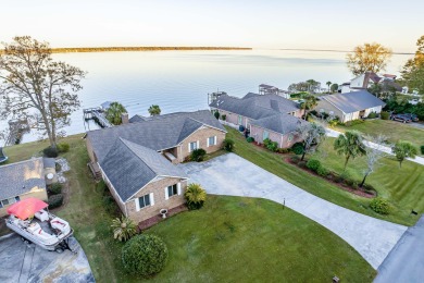 Welcome home to this LAKEFRONT ranch style home located in the on Santee-Cooper Country Club in South Carolina - for sale on GolfHomes.com, golf home, golf lot
