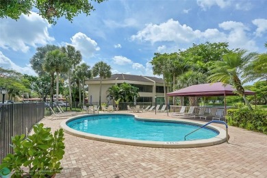 Exceptional Corner Unit Condo nestled in the gated community of on Boca Pointe Country Club in Florida - for sale on GolfHomes.com, golf home, golf lot
