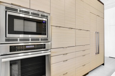 Welcome to this stunning, fully renovated contemporary residence on Bocaire Country Club in Florida - for sale on GolfHomes.com, golf home, golf lot