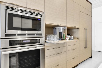 Welcome to this stunning, fully renovated contemporary residence on Bocaire Country Club in Florida - for sale on GolfHomes.com, golf home, golf lot